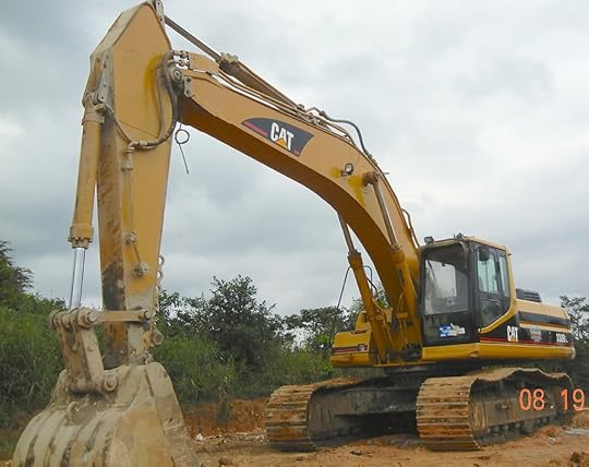 AN EXCAVATOR USED TO DIG PITS AND OBTAIN GRAVEL FOR WASHING