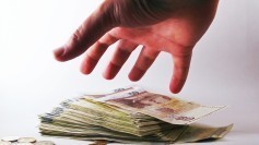 Hand grabbing cash