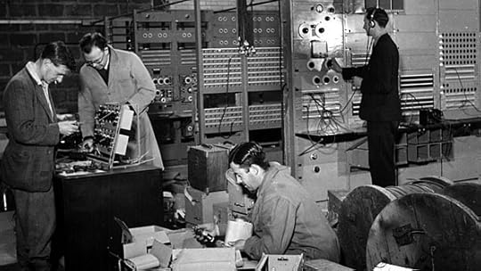 Men putting electronics together.