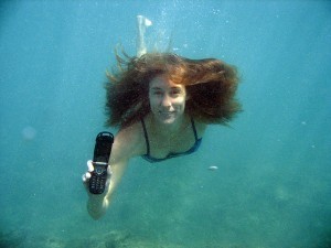 woman-underwater-phone-300x225