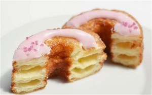 A cronut is croissant dough, fried like a donut, filled with sweet, flavored cream, and iced. 