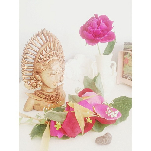 Earlier today I told John all about the beautiful way the Balinese people leave offerings/blessings everywhere. Later he went out into our yard and gathered up petals and leaves and created this gorgeous offering/blessing for me. How sweet is that? I put 