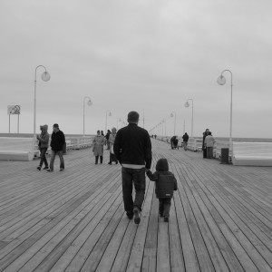 father and son on pier