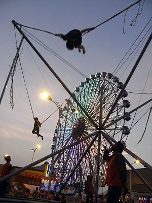 English: Bungee trampolinists in front of the ...