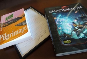 Photo of Pilgrimage and Framed Manuscript Page of Pilgrimage by Matthew Wayne Selznick from J. C. Hutchins