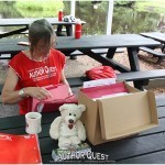 Camp Director Ann Rowland prepares everything for author check-out
