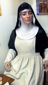 A figure of an 1800 Benedictine nun at Museum für Klosterkultur, 2009 photo by Andreas Praefcke, released to public domain via Wikimedia Commons