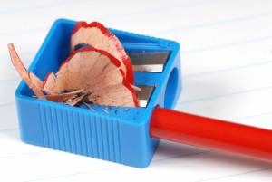 A pencil being sharpened in a pencil sharpener