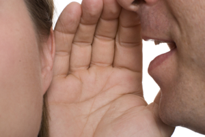 Image of a whisper to symbolize your brain talking to you - Self talk, body chemistry, and successful fundraising