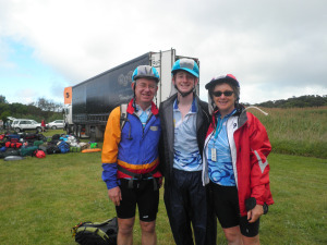 At the finish line in the wet on Sunday with DH and Boy Wonder after riding 591km