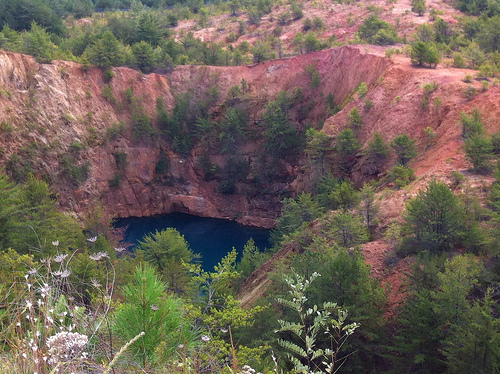 Crater caused by mine collapse, now full of water