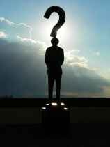 male statue with question mark overhead