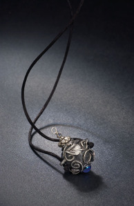 Vessel necklace, silver and glass cabochon, with removable lid. From my days as a silversmith.