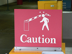 Caution sign, in parking on 5th street