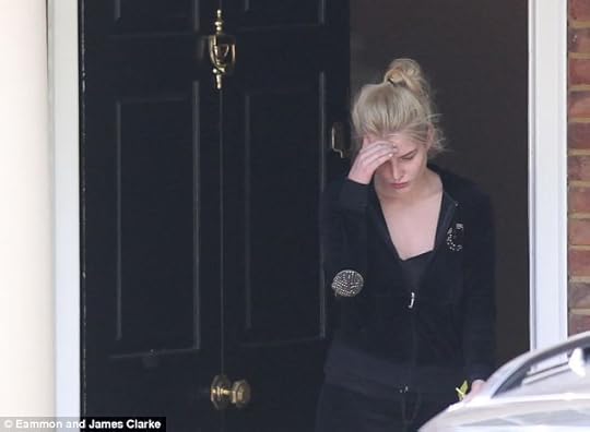 Helen Flanagn emerges from her home in Prestbury, Cheshire, days after she was burgled