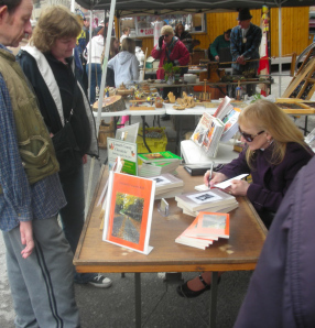 Signing a book Maple Fest Apr 27 20130001