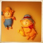 chalkware piggies supervise the fun