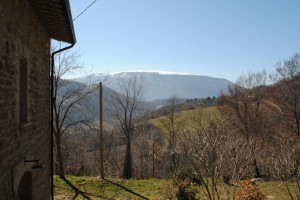 The view from the porch of snow-topped Mount Subasio