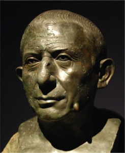 The sculpture that gave us the expression 'warts and all', the head of a <br />herm - a marble pillar showing nothing else except genitals - found in the <br />house of Lucius Caecilius Iucundus at Pompeii. Anyone who has done the <br />Cambridge Latin course will know this man and his family, though the <br />coursebooks don't show the full detail of his herm! One of the great <br />revelations of Pompeii and Herculaneum - like shipwreck finds of works of <br />art - was the survival of bronze sculptures, as most bronzes from <br />antiquity were melted down in subsequent centuries for their metal.