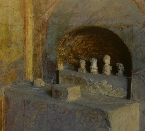 A shrine with crude images of ancestors from the House of the Menander, <br />Pompeii.