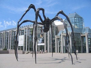 This spider wove the internet! No, really! And I'm its queen. (Photo by Kewima, sculpture outside Canadian Art Musuem, Ottawa.)