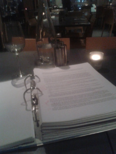 WINE AND PROOFING: An image taken during the proofing of one of Enormity's drafts.