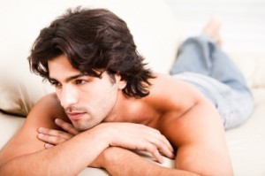 Attractive young man lying down