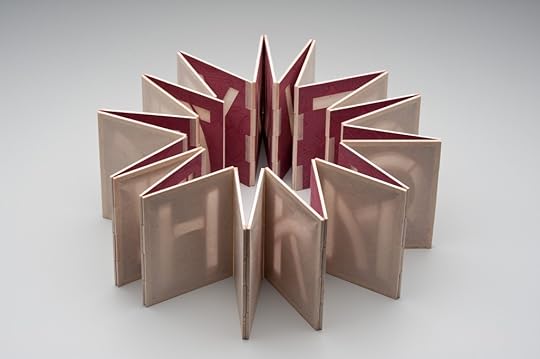 Alpha, Beta, ... a light-activated book with a flexible hinge