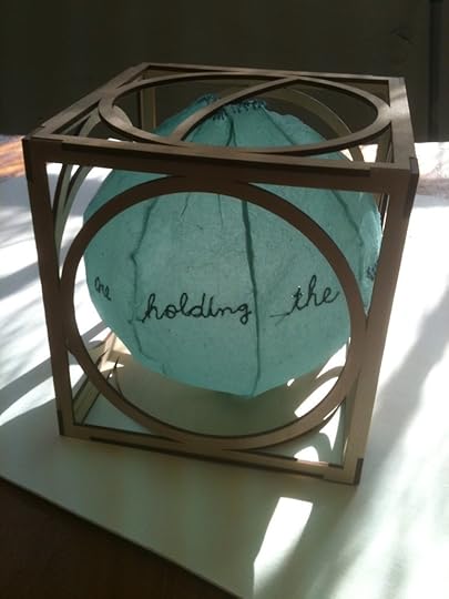 Global WarNing, inflatable paper ball with embroidered message in a laser cut box