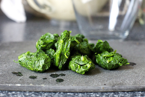 squeezed fistfuls of spinach