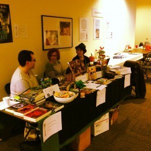 Django Wexler, Janine Southard, and Louise Marley at a book table.