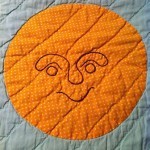 benevolent baby quilt sun
