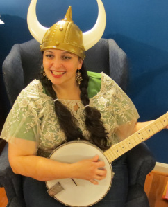 Summer Kinard with banjo and viking helmet