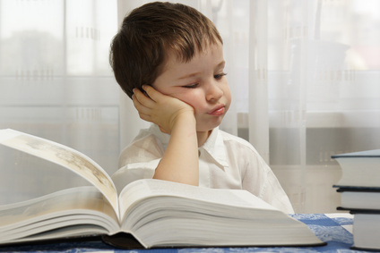 bored boy with book