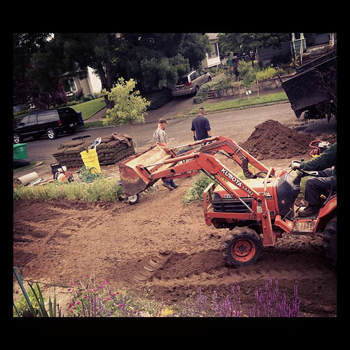 Current scene in our front (and back) yards today. Getting new sod;) True is LOVInG the trucks.