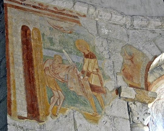 Martin of TOurs cuts his cloak to give to a beggar, depicted on the walls of the church of Saint Hilary, Poitiers.