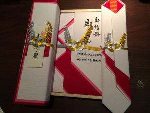 The personalized wedding envelopes Akemi's family prepared for the wedding. is this a subtle hint?