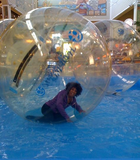 Wambui Bahati inside a giant ball in water