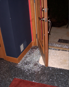 The inside view of the broken front door window of Dr. Jerome and Carla Pavlin after McHenry County Sheriff Deputies smashed there way into the house.
