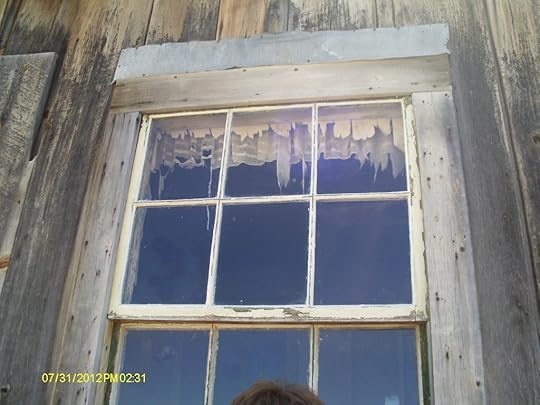Window with tattered lace in Bodie