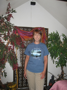 Kimberly in front of a portal in her space
