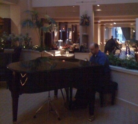 The Conductor plays piano at The Cincinnatian