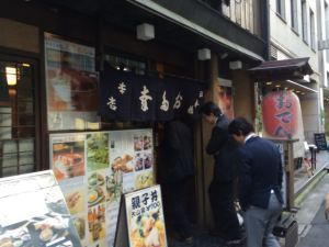 Following the line of customers into the restaurant. The joint is jumping.