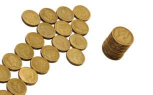 Gold coin arrow and pile on white © aussiesnakes - Fotolia.com