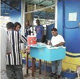 Vendors wake in the wee hours to cook up a batch of curried chickpeas and <br />fry up stacks of bread for the day.