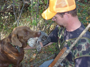 My good friend Scott with a ruffed grouse from a covert named, Grouse Alley. 