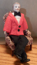 Man doll in particularly ridiculous-looking red jacket.