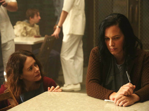 Lana (Sarah Paulson) talks to Anne Frank (Franka Potente) in FX's American Horror Story Asylum