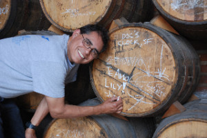 Julio Bermejo signs a barrel at Arette distillery in Tequila.