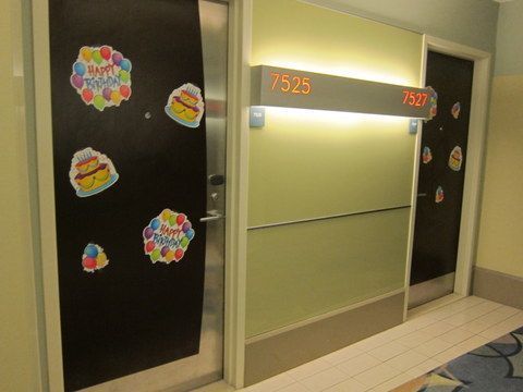 Hotel doors are public space. Should they be decorated?